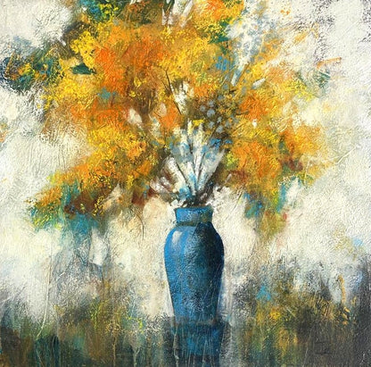 Bring colour, warmth and expressive energy into your home with this beautiful original floral artwork, featuring a striking arrangement of yellow flowers displayed in a blue vase. This contemporary still life painting combines bold colour with soft, textured detail, creating a piece that feels both lively and elegant. The vivid floral tones contrast beautifully with the cool blue vase, while the loose, expressive brushwork gives the artwork a sense of movement and depth.
