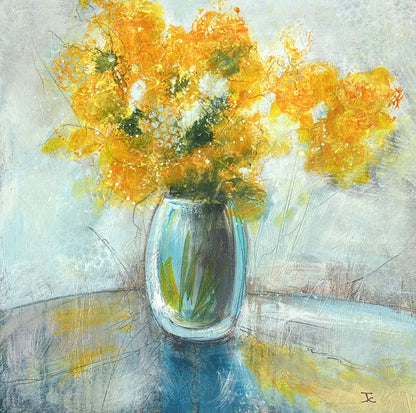 Bring colour, warmth and expressive energy into your home with this beautiful original floral artwork, featuring a striking arrangement of yellows flowers displayed in a opaque vase. This contemporary still life painting combines bold colour with soft, textured detail, creating a piece that feels both lively and elegant. The vivid floral tones contrast beautifully with the cool blue vase, while the loose, expressive brushwork gives the artwork a sense of movement and depth.